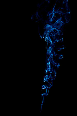 blue rings and curls of smoke on black backgroundの写真素材