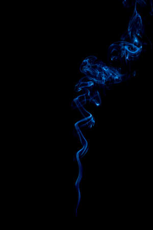 blue rings and curls of smoke on black backgroundの写真素材