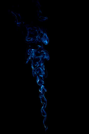 blue rings and curls of smoke on black backgroundの写真素材