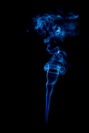 blue rings and curls of smoke on black backgroundの写真素材