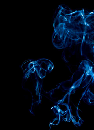 blue rings and curls of smoke on black backgroundの写真素材