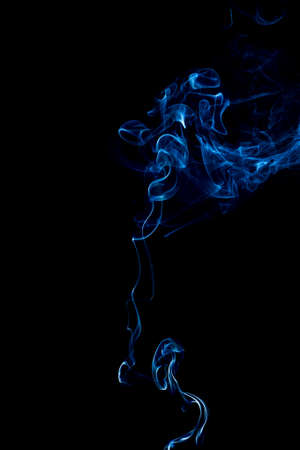 blue rings and curls of smoke on black backgroundの写真素材