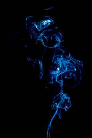 blue rings and curls of smoke on black backgroundの写真素材