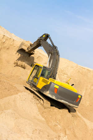 Working Yellow Excavator at Construction Site