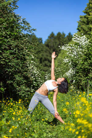 girl doing yoga outdoor, verticalの写真素材