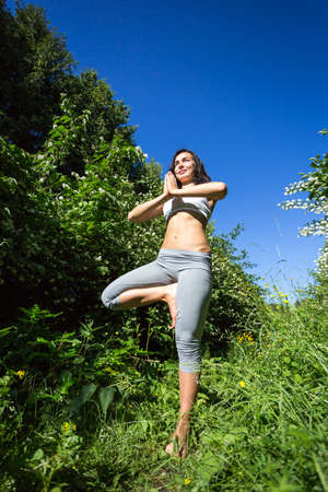 girl doing yoga outdoor, verticalの写真素材