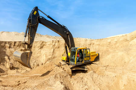 Yellow Excavator work at Construction Siteの写真素材