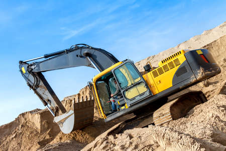 Yellow Excavator work at Construction Siteの写真素材