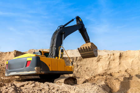 Yellow Excavator work at Construction Siteの写真素材