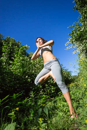 girl doing yoga outdoor, verticalの写真素材