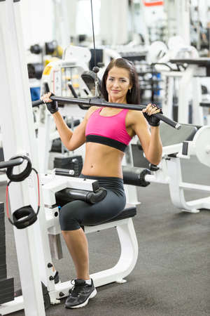 young women do a workout at the gym の写真素材