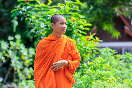 Portrait of Young Buddhist Monk at Sunny Dayの写真素材