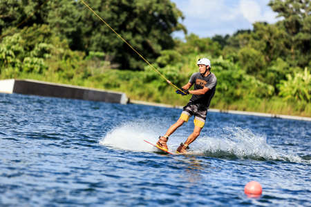 Man Wakeboarding in action. Phuket, Thailand. shifted horizonの写真素材