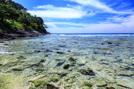 Rocky beach at sunny day in Phuket, Thailandの写真素材