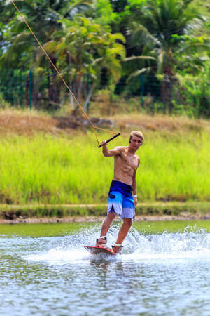Man Wakeboarding in action. Phuket, Thailandの写真素材