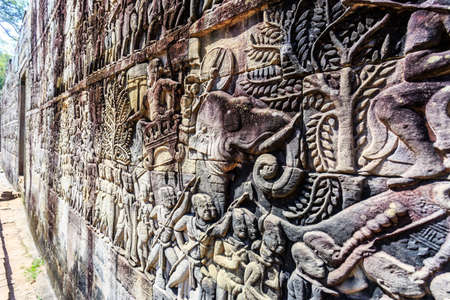 Bas relief at ancient buddhist khmer Bayon temple in Angkor Thom, Siem Reap, Cambodiaの写真素材