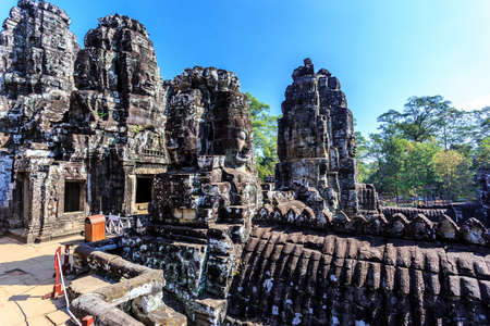 Giant stone faces of ancient buddhist khmer Bayon temple in Angkor Thom, Siem Reap, Cambodiaのeditorial素材