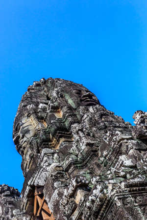 Giant stone faces of ancient buddhist khmer Bayon temple in Angkor Thom, Siem Reap, Cambodiaのeditorial素材