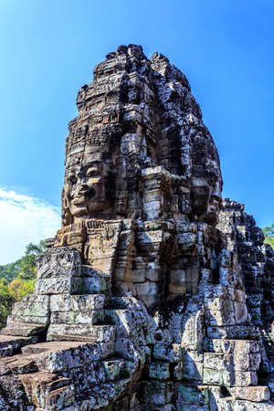Giant stone faces of ancient buddhist khmer Bayon temple in Angkor Thom, Siem Reap, Cambodiaのeditorial素材
