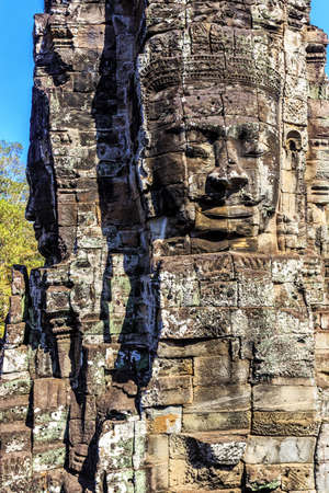 Giant stone faces of ancient buddhist khmer Bayon temple in Angkor Thom, Siem Reap, Cambodiaのeditorial素材