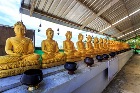 Golden Buddha row in Big Buddha temple. Phuket, Thailandの写真素材