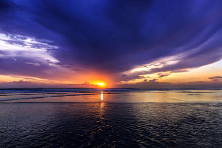 Magic Dramatic Unreal  Sunset in Kuta beach, Bali, Indonesiaの写真素材