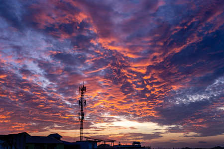 Magic Unreal Colorful Sky at Sunrise silhouette signal antenna towerの写真素材