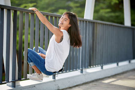 Close-Up fashion portrait of young Asian elegant woman posing in the corridorの写真素材