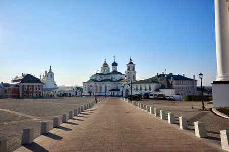 Historic Epiphany Church with green domes at Nikolaevsky Arzamas Monastery on Cathedral Square, Arzamas, under a clear blue skyの写真素材