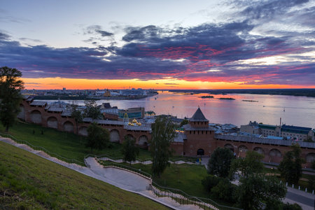 A stunning sunset capturing the famous view of Kremlin and the arrow in Nizhny Novgorod, where the Oka River flows into the mighty Volgaの写真素材