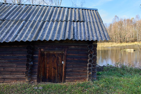 Step back in time with this haunting image of an old, abandoned Russian bathhouse, showcasing the rustic beauty and eerie serenity of forgotten traditionsの写真素材