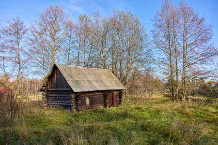 Step back in time with this haunting image of an old, abandoned building, showcasing the rustic beauty and eerie serenity of forgotten traditionsの写真素材