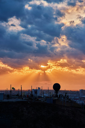 Silhouette featuring a hot air balloon set against a breathtaking sunset, vibrant clouds, and rays of sunlight, creating a dreamy and magical atmosphere, Nizhny Novgorodの写真素材