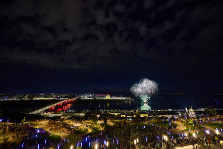 Colorful Fireworks  over Strelka in Nizhny Novgorod, featuring Kanavinsky Bridge and the illuminated Alexander Nevsky Cathedral. 9 Mayの写真素材