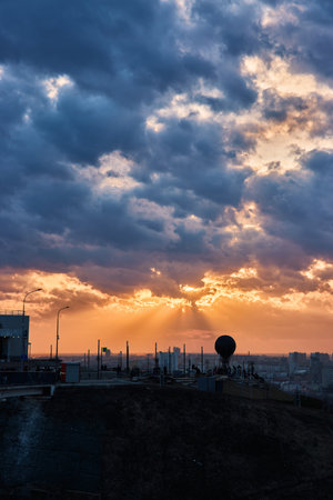 Silhouette featuring a hot air balloon set against a breathtaking sunset, vibrant clouds, and rays of sunlight, creating a dreamy and magical atmosphere, Nizhny Novgorodの写真素材