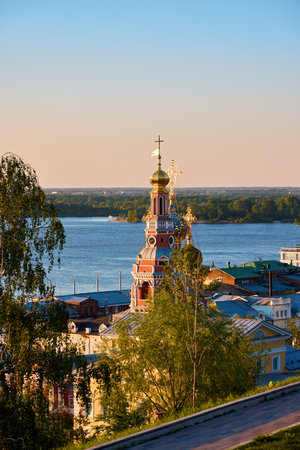 Stroganov Church stands majestically with the Volga River  in the background, capturing the serene beauty of Nizhny Novgorod at dusk with its historic charmの写真素材