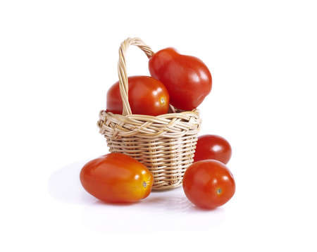 ripe cherry tomatoes in a basketの写真素材