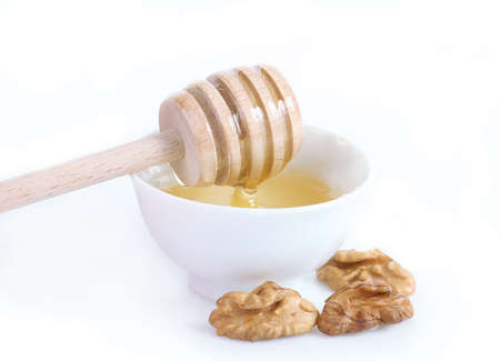 spoon of honey and walnutsの写真素材