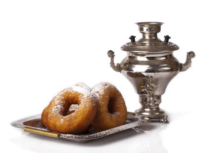 samovar and donuts with powdered sugar