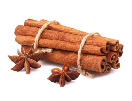 Cinnamon sticks and anise isolated on white.の写真素材