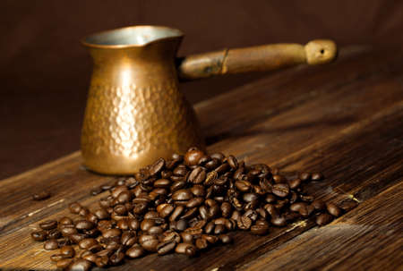 Coffee beans on old wooden tableの写真素材