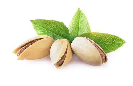 Pistachio nuts with leaves isolated on white.の写真素材
