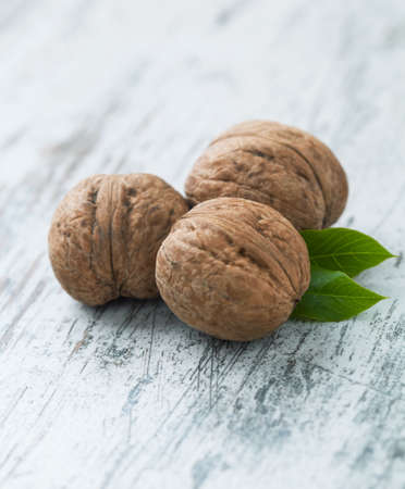 Walnuts on a wooden table.の写真素材