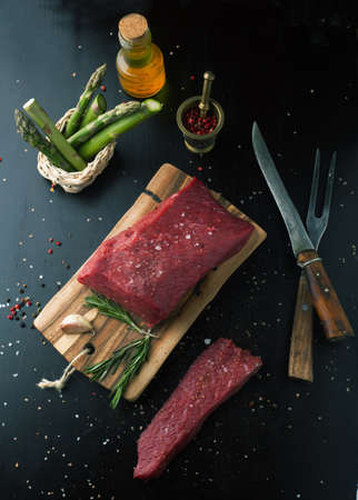 Fresh raw beef steak on a wooden boardの写真素材