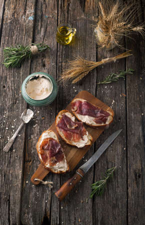 Ciabatta Bread with meat Black Angus Beef with cheese paste and rosemary on a wooden backgroundの写真素材