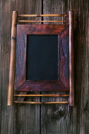 Old vintage wooden frame on a wooden backgroundの写真素材