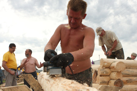 TOMSK, RUSSIA - AUGUST 9: Annual international festival-competition of carpenters "Holiday of Axe", August 9, 2009 in Tomsk, Russia.のeditorial素材