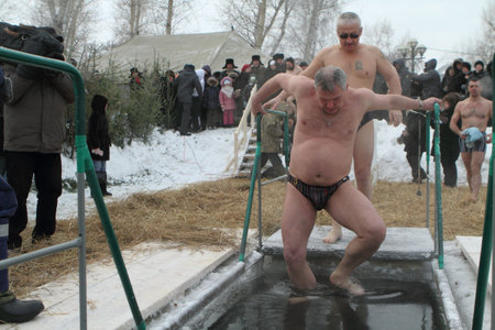 TOMSK, RUSSIA - JANUARY 19: Swimming in the ice-hole, celebration of Epiphany (Holy Baptism) in the Orthodox tradition, January 19, 2010 in Tomsk, Russia.のeditorial素材