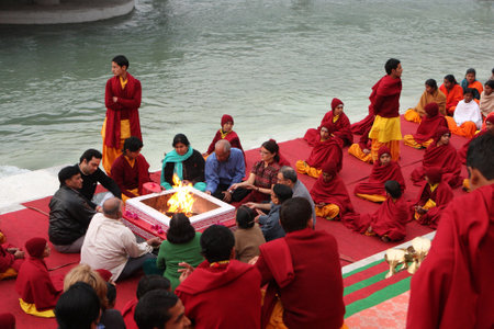 RISHIKESH, INDIA - JANUARY 19: Hindu students from the Parmath Niketan Ashram hold ceremonial lanterns during the daily aarti prayer on the River Ganges, January 19, 2009 in Rishikesh, India.のeditorial素材