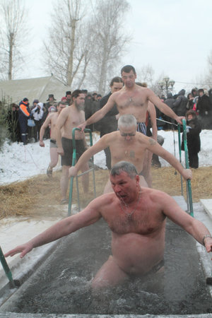 TOMSK, RUSSIA - JANUARY 19: Swimming in the ice-hole, celebration of Epiphany (Holy Baptism) in the Orthodox tradition, January 19, 2010 in Tomsk, Russia.のeditorial素材